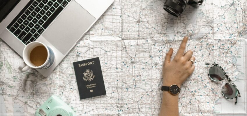 hands pointing on the map on the table