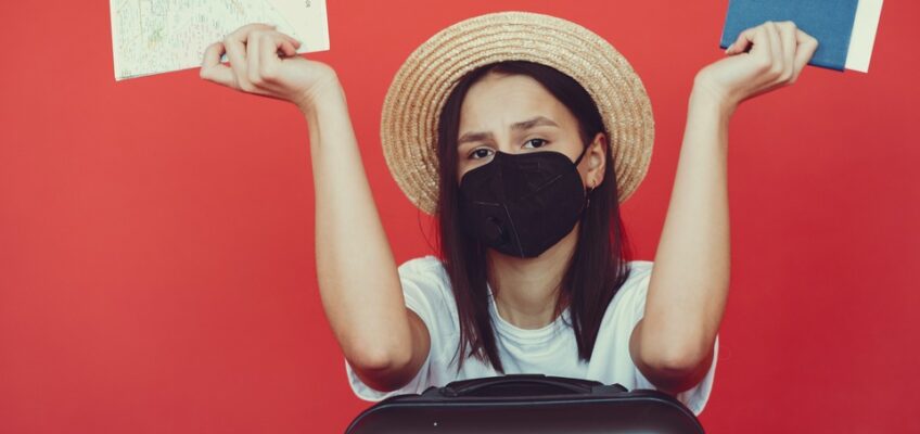 a sad woman with passport and suitcase