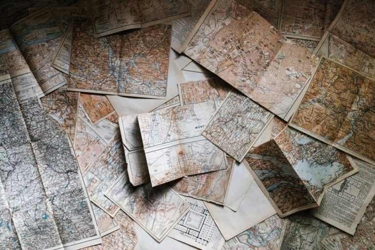 Folded maps scattered on the floor.