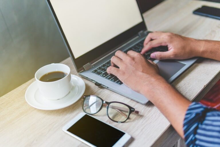 person is browsing on a laptop