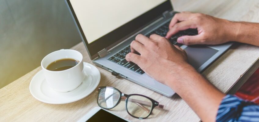 person is browsing on a laptop