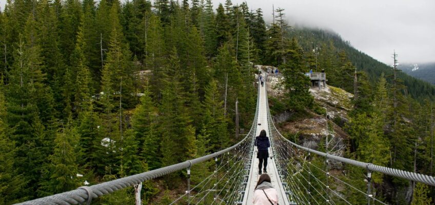 Two women at the hanging bridge at Squamish, BC, Canada.